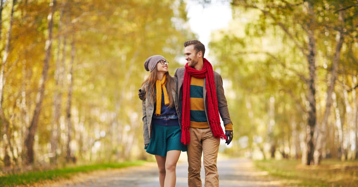 a happy couple walking