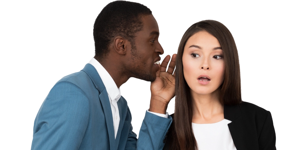 A guy and girl gossiping.