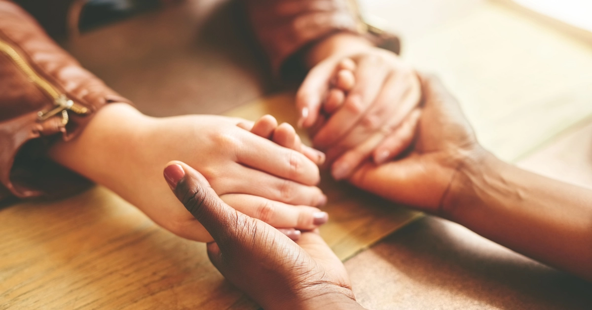 two people holding hands
