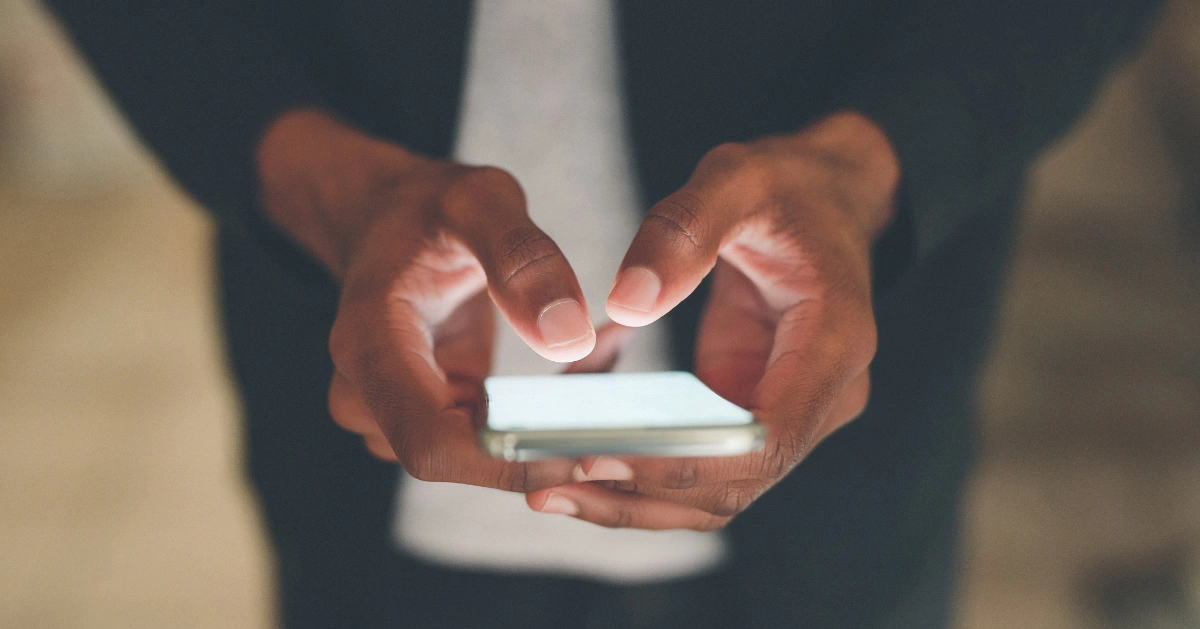 Chatting online - someone holding their cell phone