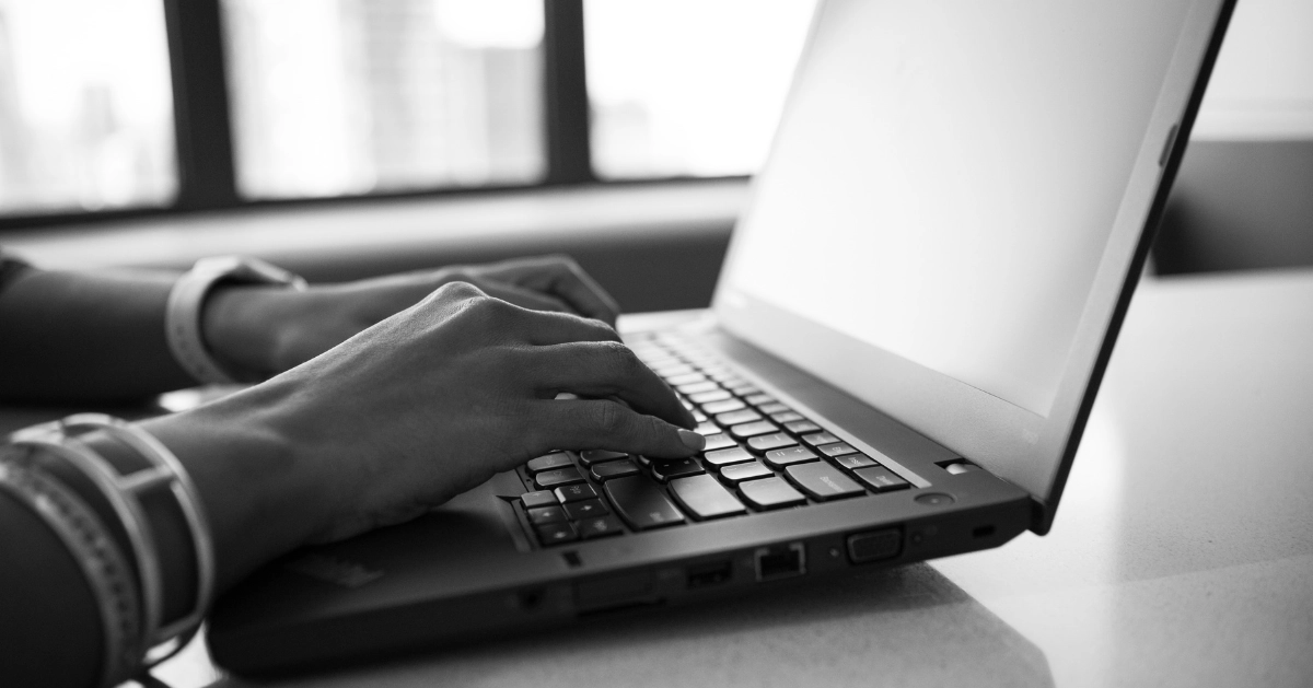 Hands on a laptop