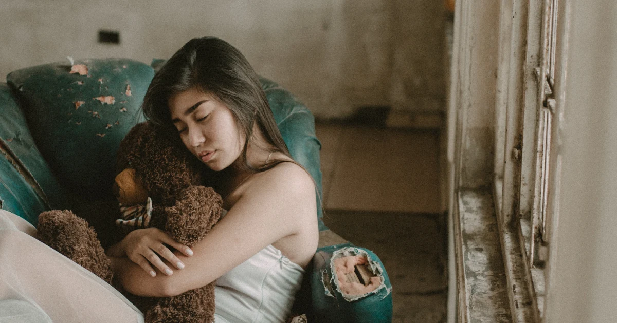 Girl holding a teddy bear