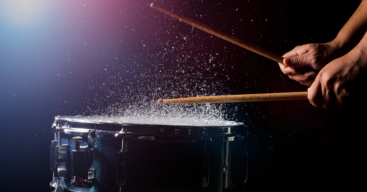 a drum being hit with drumsticks