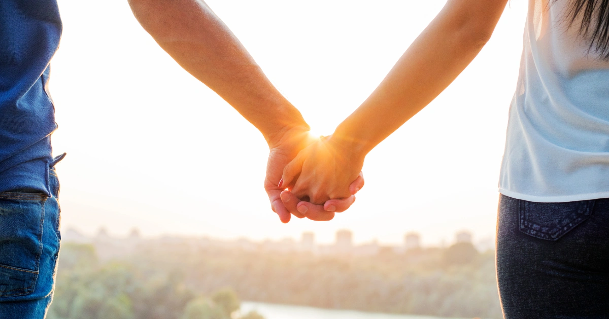 a couple holding hands
