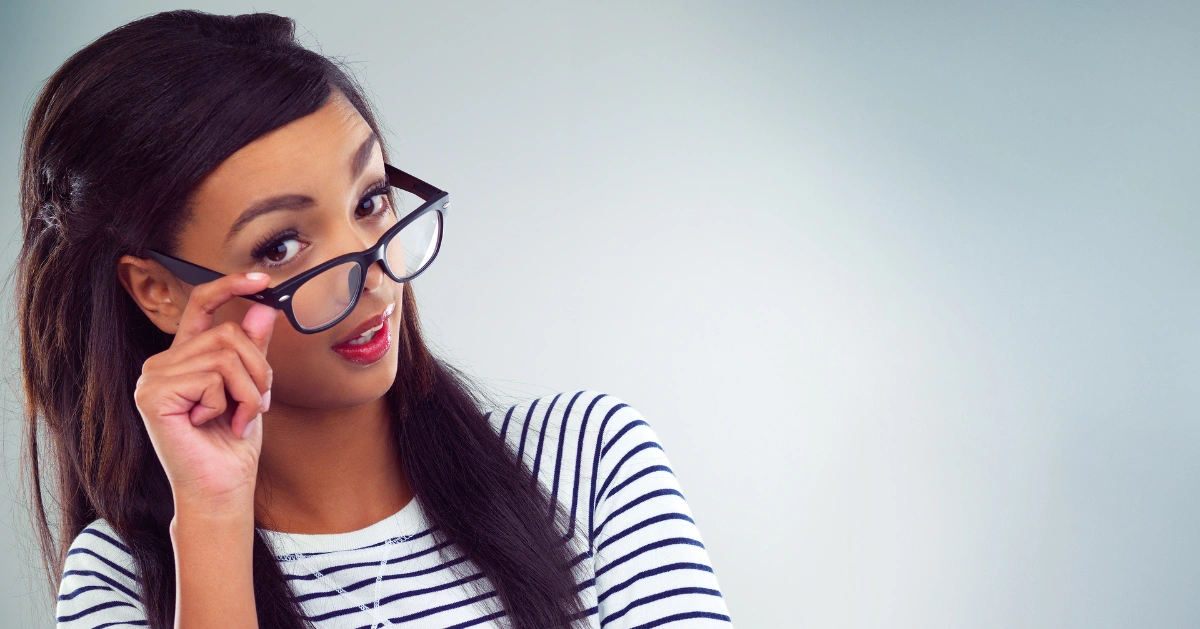 a girl wearing glasses with a look of 'Really?!"