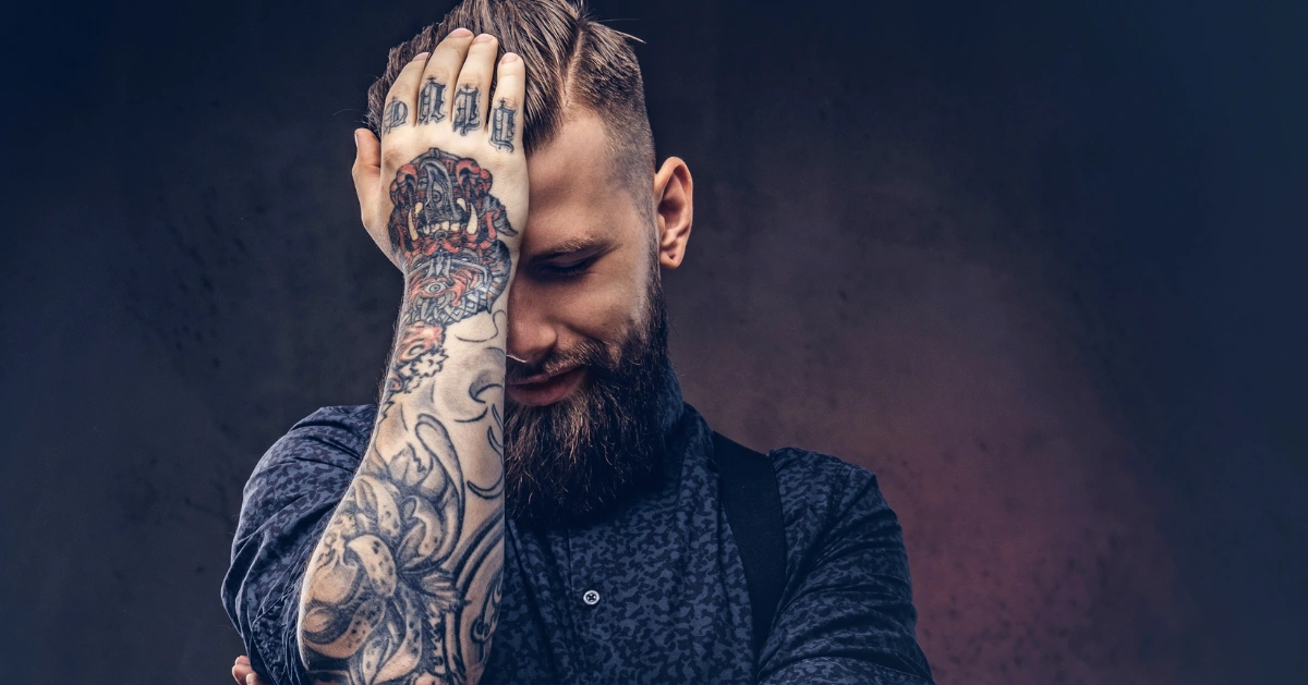 photo of a guy with tattoos