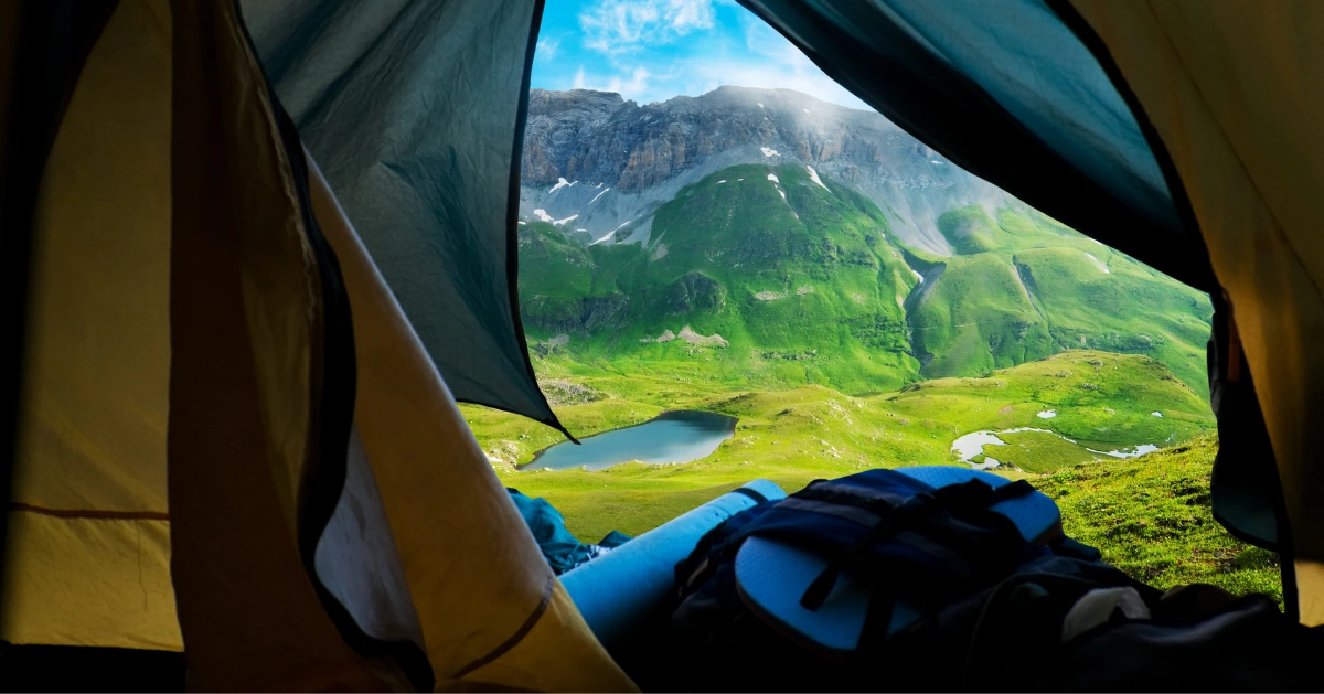 a view of the mountain from inside a tent