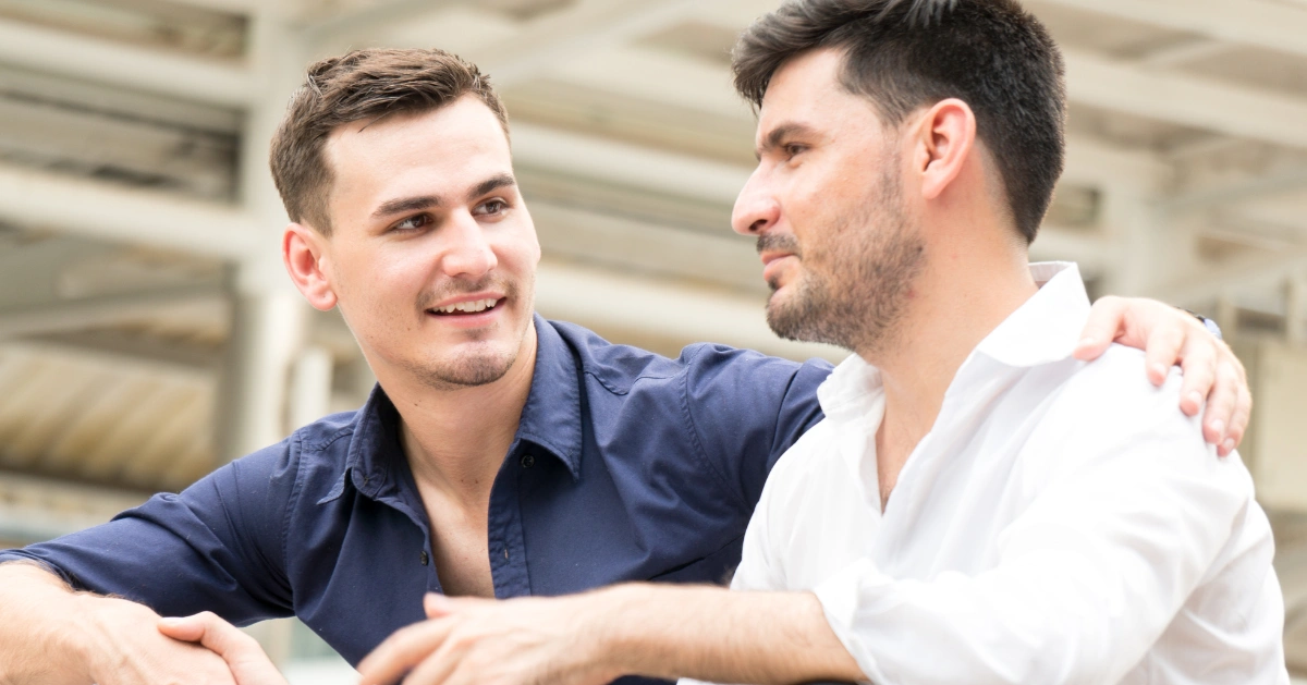 two males one comforting the other through a divorce