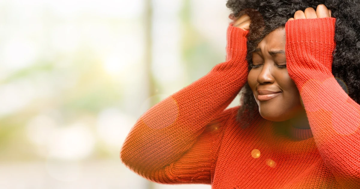 a lady holding her head from being overhwlemed