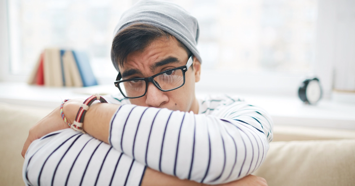 a guy with a sad expression on his face