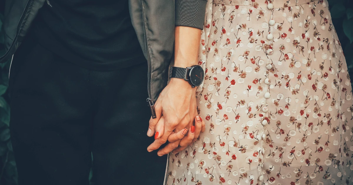 a couple holding hands