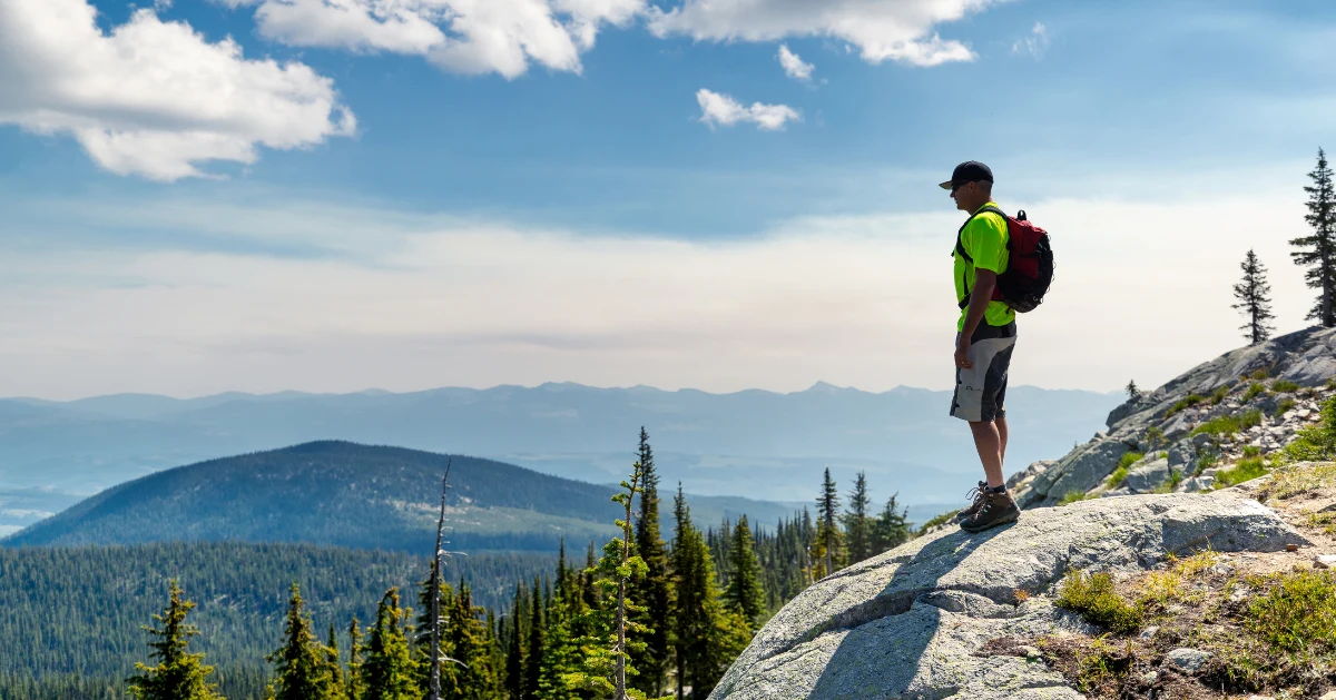 A man with a backpack hiking.