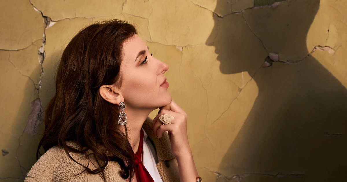 a girl looking at a silhouette of what should be her boyfriend