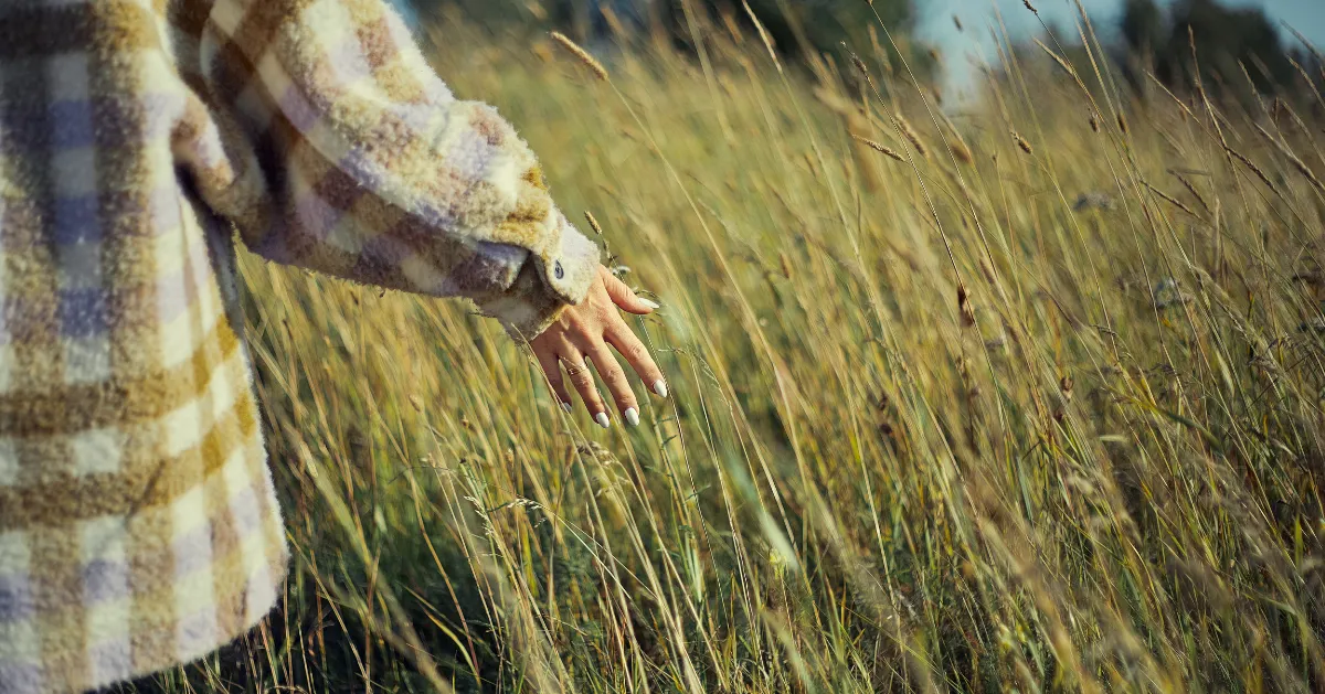 Girl walking through a field