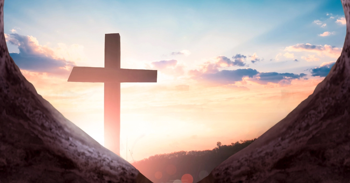 a cross outside a tombstone