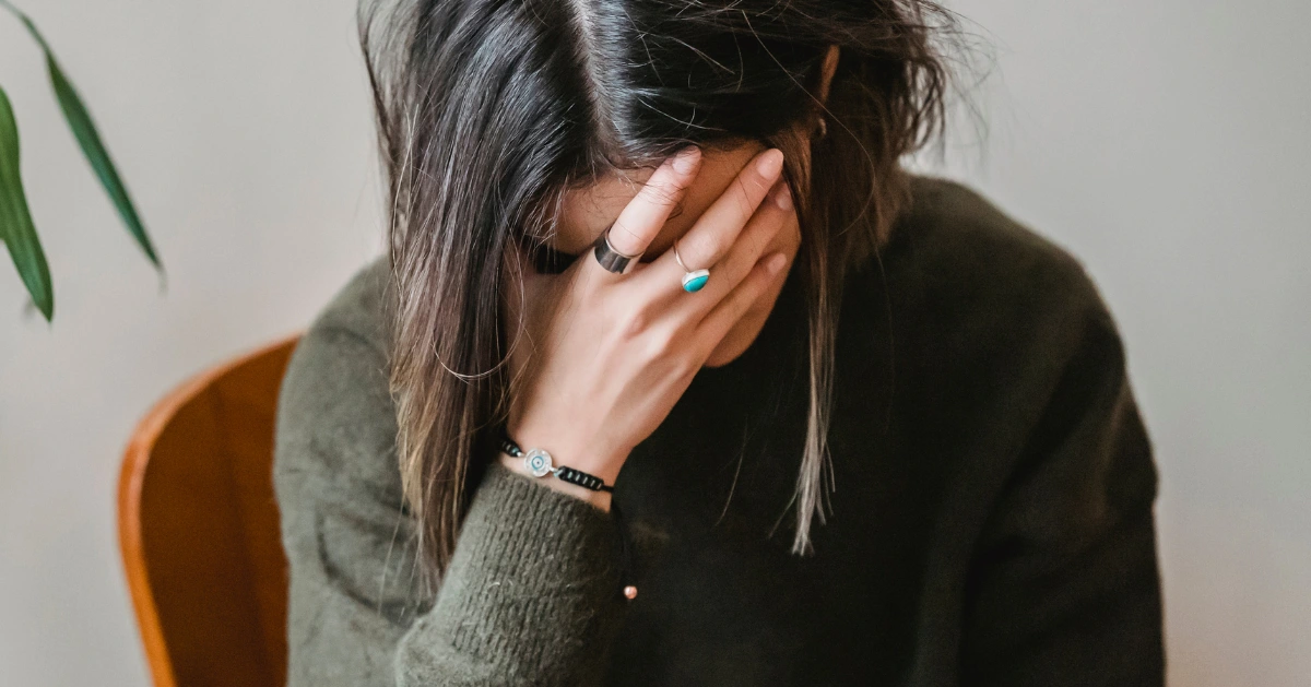 Girl hiding her face