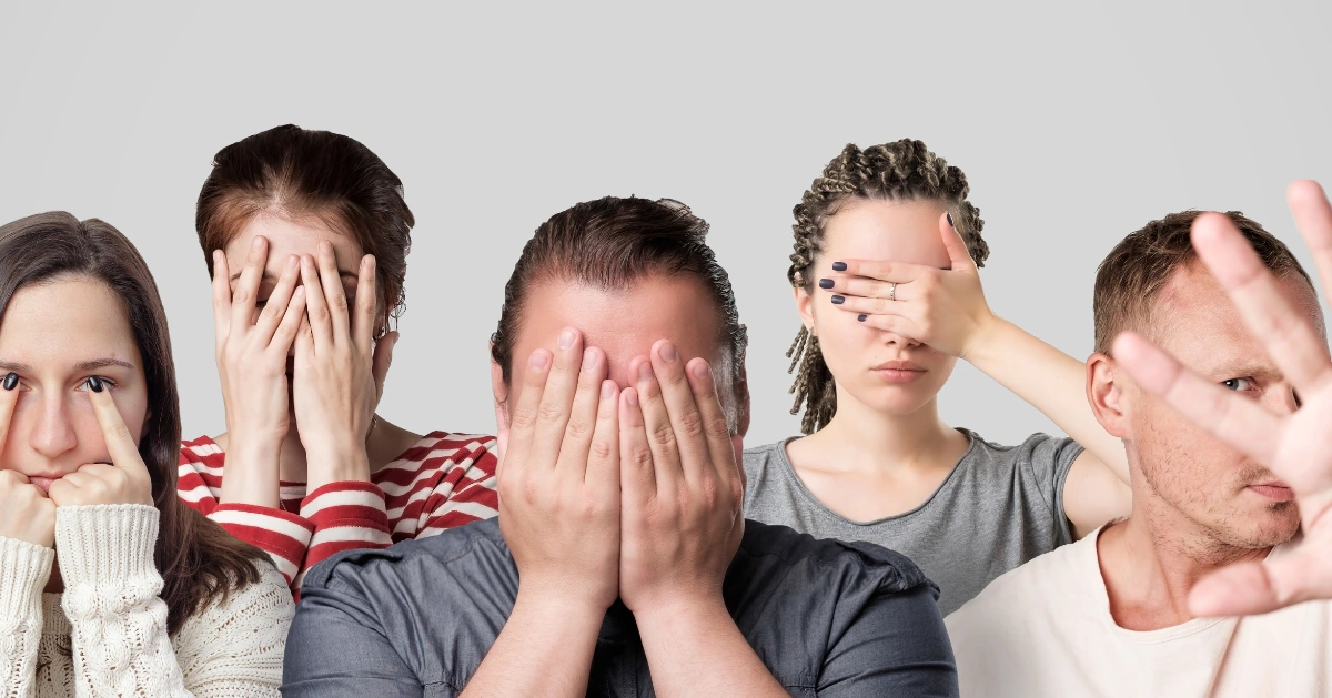 concept of shames. Group of people closing their face or eyes with hands.