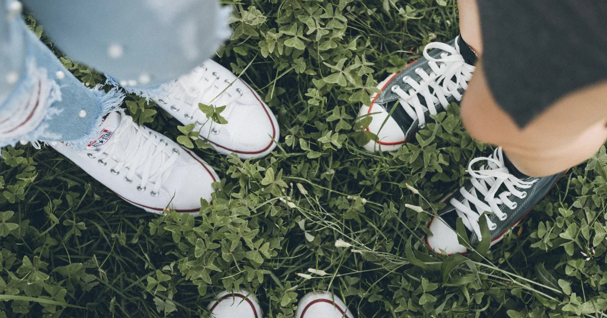 Teens wearing converse shoes.