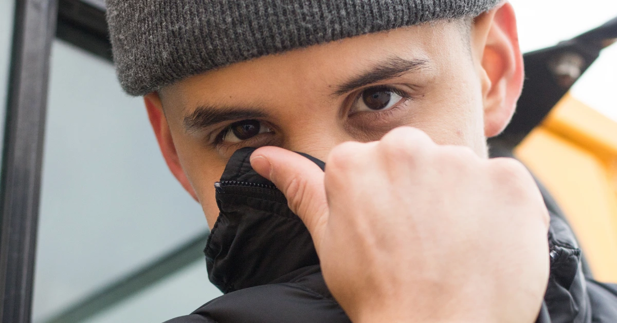 a guy covering half of his face