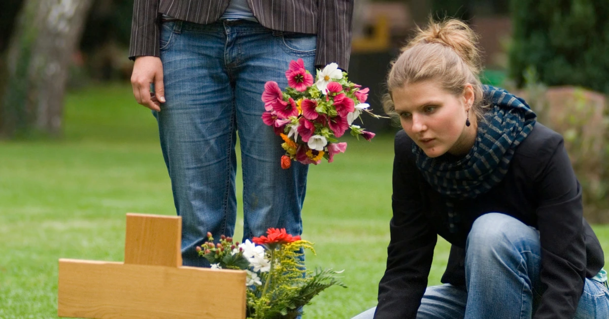 a girl at the grave site