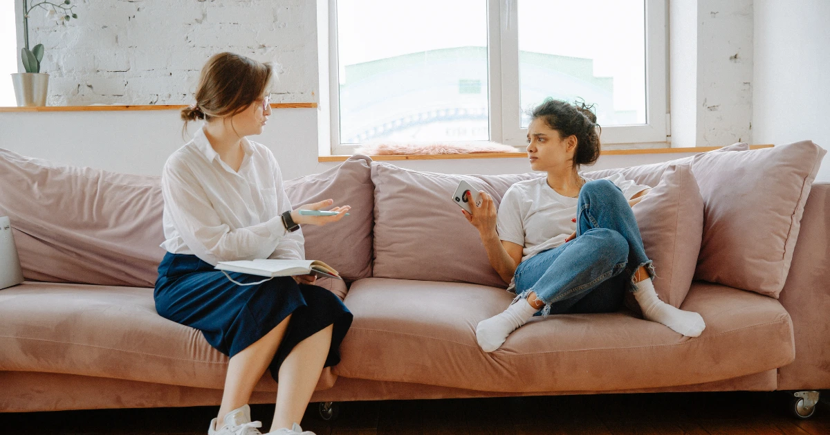 teen girl talking to a counselor