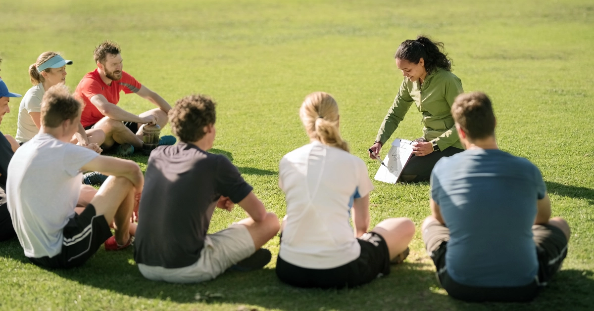 Group of young adults planning football game strategy