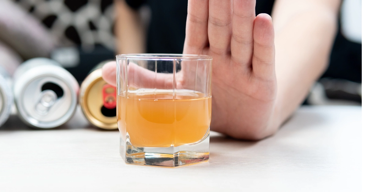 person putting a hand up when another alcoholic drink is offered