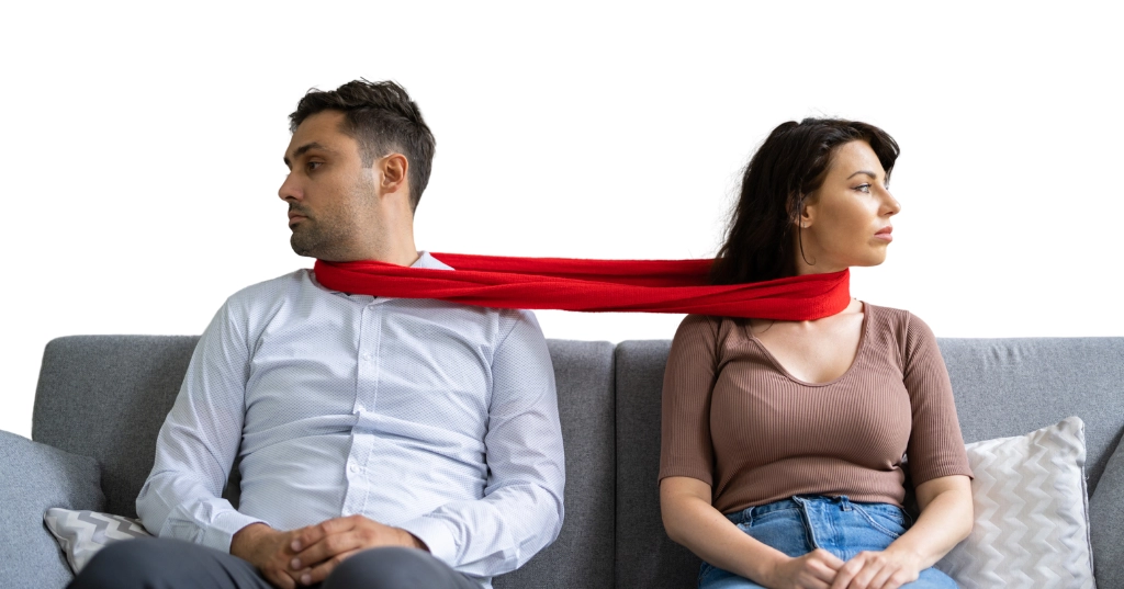 Codependent couple sitting on a sofa